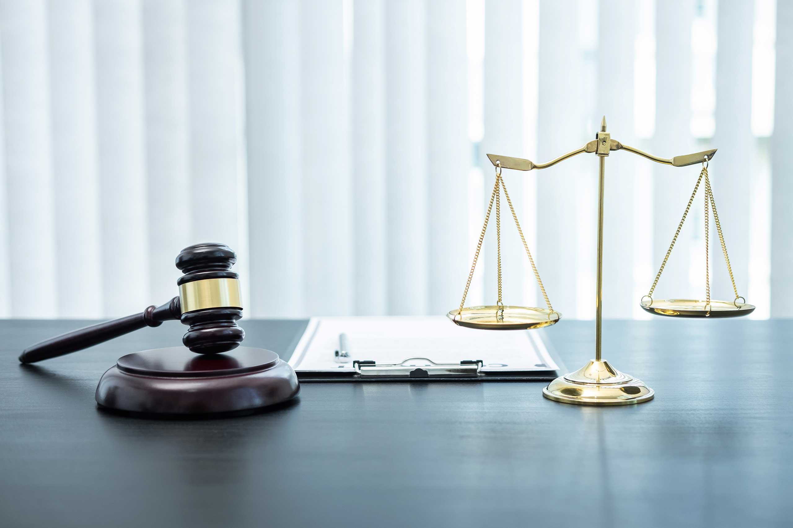 judge-gavel-with-justice-at-law-firm-in-background-2024-09-21-05-29-10-utc.jpg
